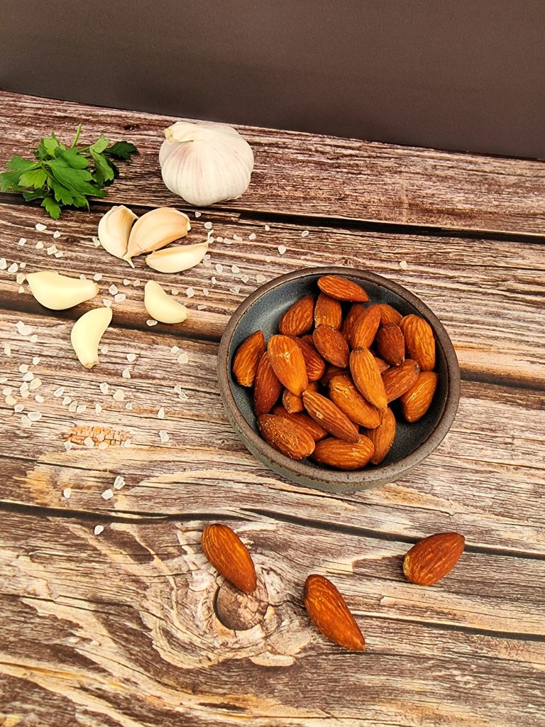 A top-down photo of Sussex Smokehouse Tom's Meaty Nuts: Almonds with parsley, garlic and salt
