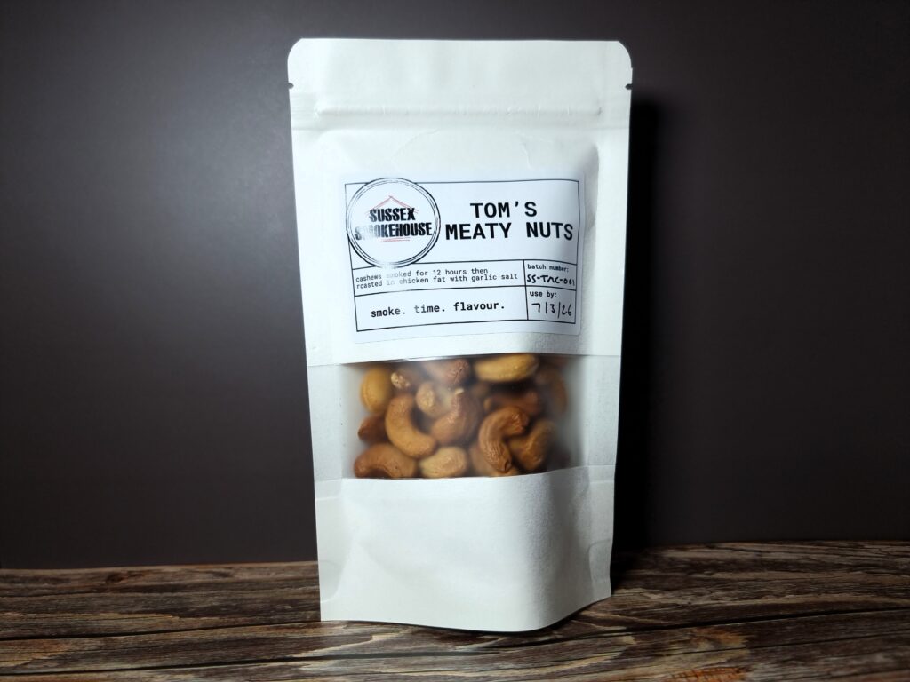 Image of Tom's Meaty Nuts: Cashews in their branded pouch